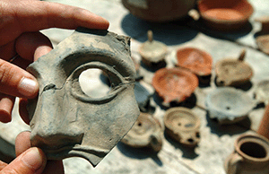 terracotta mask and lamps