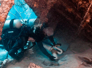 Anthropologist Philippe Rouja and archaeologist James Delgado, inside the Mary Celestia's bow