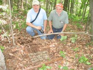 Local resident Kenny King and archaeologist Harvard Ayers display some of the munitions that were used in the battle