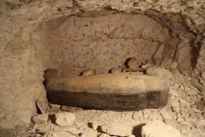A wooden coffin holding
the remains of a temple
singer